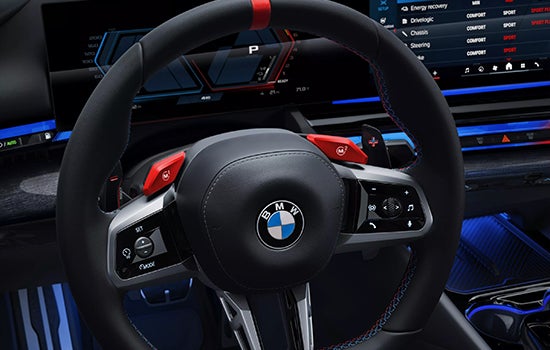 Close-up view of BMW M5 Touring steering wheel. | Enterprise BMW in Appleton WI